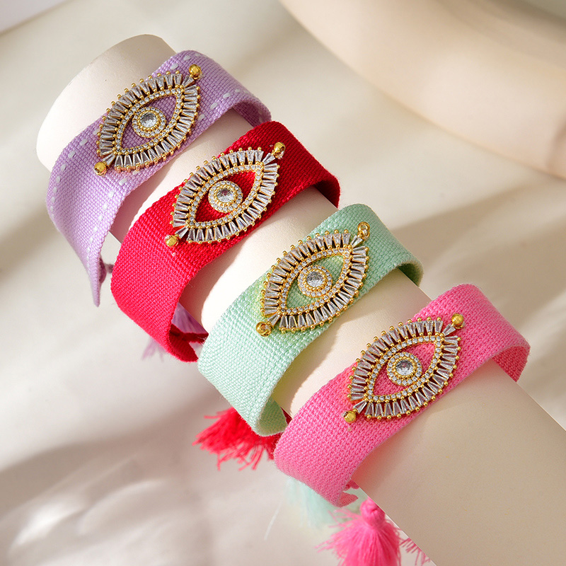 Pulsera De Borlas Trenzadas De Tejido Con Ojos De Circonitas Incrustadas En Cobre