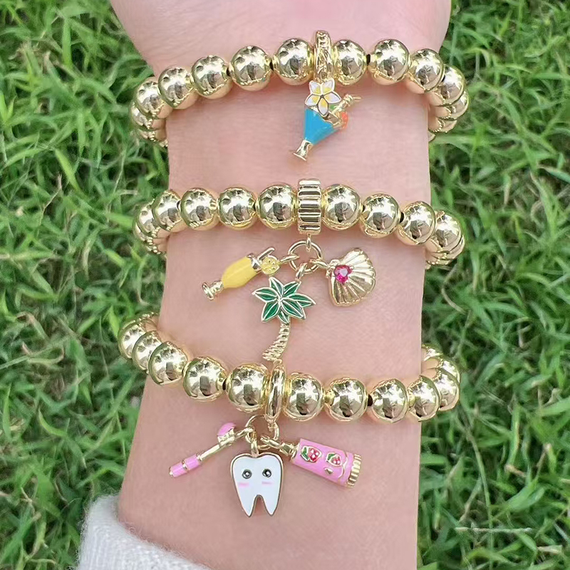 Pulsera De Dientes Con Cuentas De Cobre Bañadas En Oro